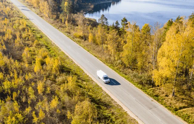 Overhead view of car driving on road
