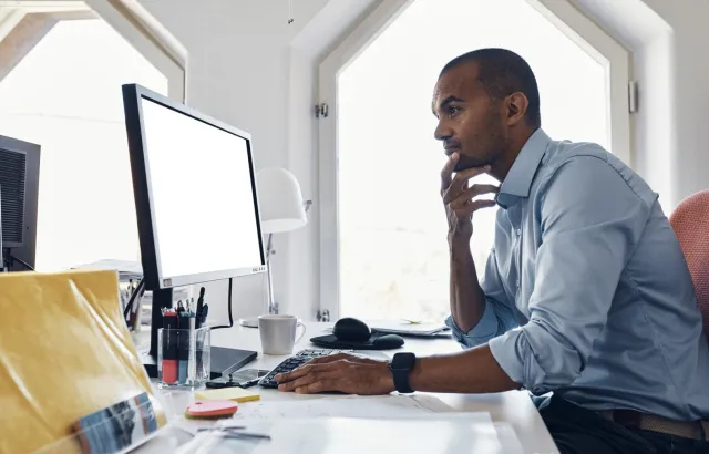 Man working on his computer in an office