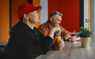 People relaxing in Circle K with drinks and snacks